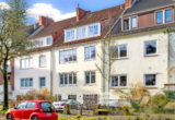 Außenansicht - Charmante 3-Zimmer-Wohnung im Hochparterre mit Balkon, Garage und grünem Gemeinschaftsgarten