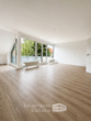 Wohnzimmer - Modernisierte 3-Zimmer-Wohnung mit Einbauküche und mehreren Balkonen in Hameln!