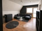 Wohnzimmer Wohnung OG - Vermietetes Zweifamilienhaus mit ausgebautem Spitzboden, 2 Garagen & Entwicklungspotenzial